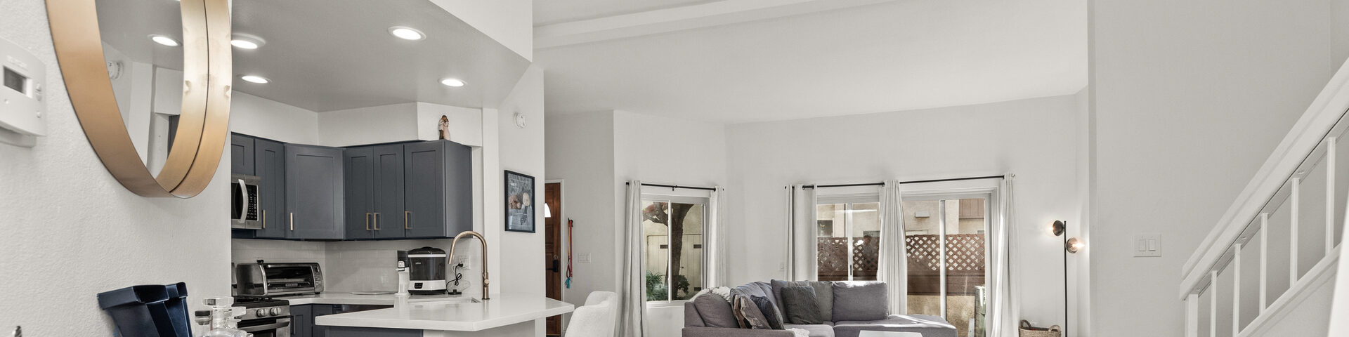 Open kitchen, living room, and stairs in one frame