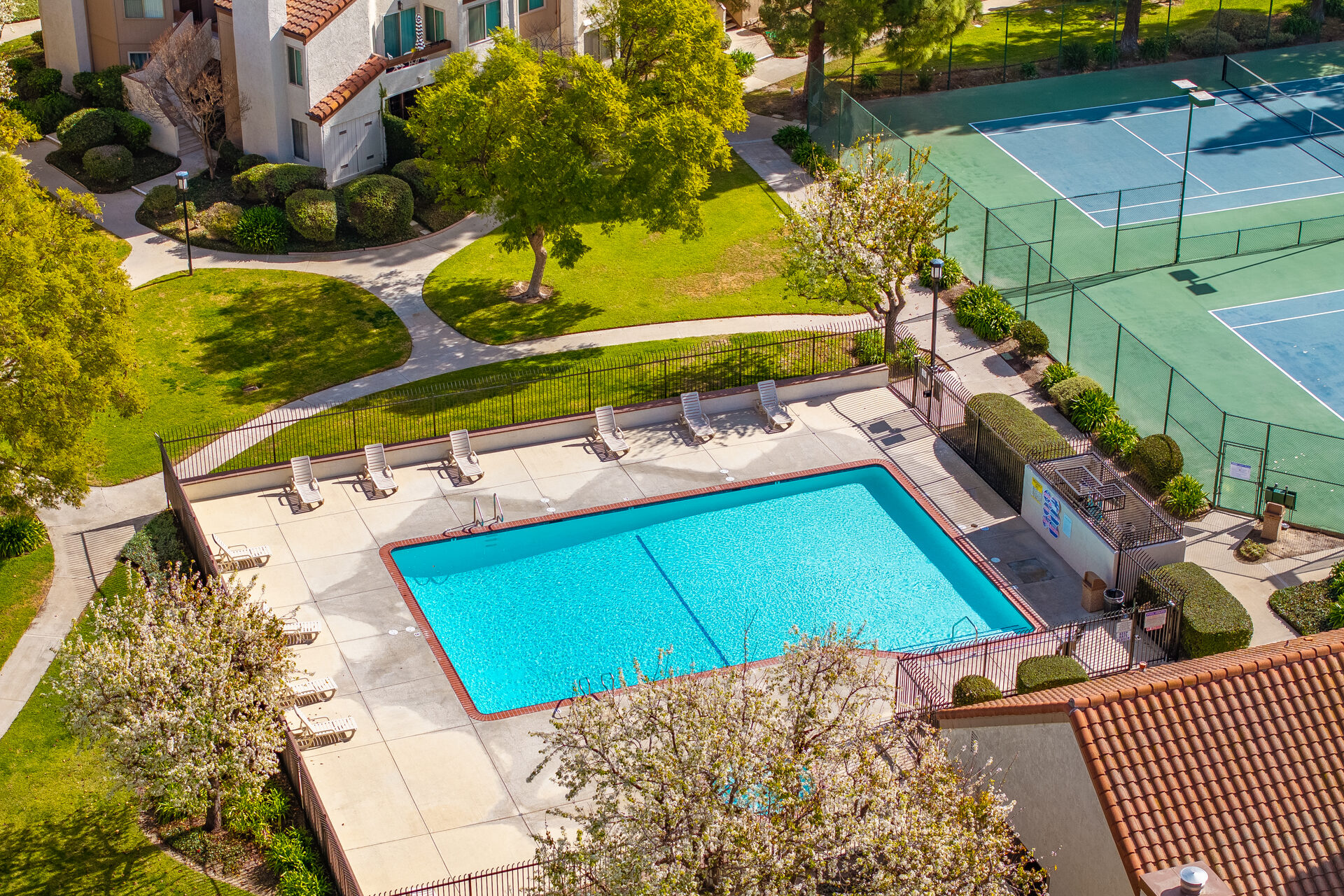 Aerial of community pool and tennis